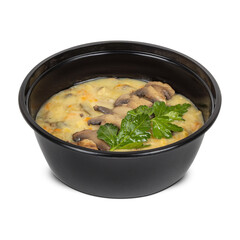 A warm bowl of soup with mushrooms and parsley on top