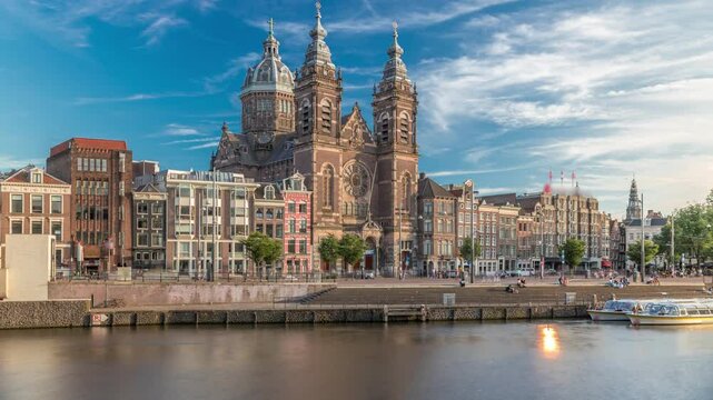 Hyperlapse of the Basilica of Saint Nicholas in Amsterdam's Old Centre near the Central Station. People walking along the waterfront by the boat station timelapse. Amsterdam, Netherlands