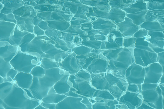Blue water in swimming pool background