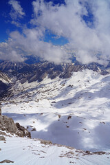 Snowy view of the summit of the Zugspitze, the highest mountain top in Germany in the Bavarian Alps region, in summer