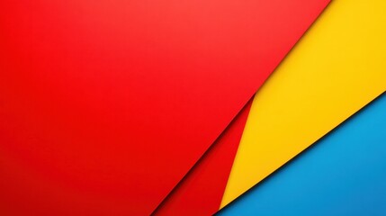 Fototapeta premium Abstract image featuring vibrant red, yellow, and blue geometric shapes. The color blocks create a dynamic composition with sharp lines and