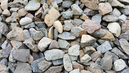 Close up of rough stones arranged randomly in the background. background concept.