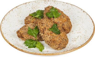 A white plate that is beautifully topped with fried food and fresh greens