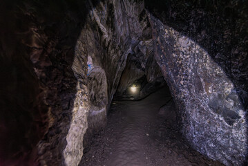a narrow path in Ancient underground cave gruta de san pedro in atocha bolivia with beautiful stone...