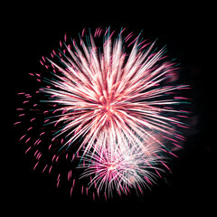 Colorful celebration fireworks isolated on black sky background.