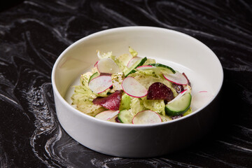 A vibrant and healthy Fresh Garden Salad made with crisp Radishes and cooling Cucumbers