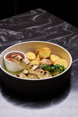 Delicious Grilled Chicken Skewers Served with Potatoes and Flavorful Sauce for Enjoyment