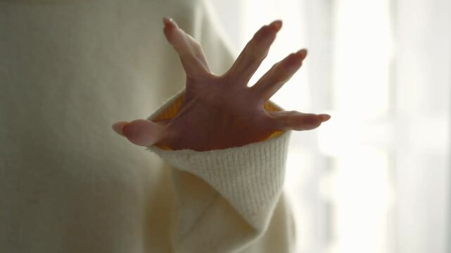 The girl wants to scratch someone.
A girl with sharp nails on her hands.
Sharp and long manicure.
The girl threatens to scratch the man.
Woman's hand in front of the camera