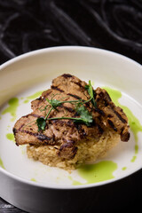 Deliciously Grilled Chicken Infused with Fresh Herbs Presented on a Minimalist Plate Design