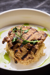 Deliciously Grilled Chicken Infused with Fresh Herbs Presented on a Minimalist Plate Design