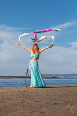 Young sexy woman posing in oriental dance costume