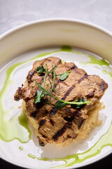 Deliciously Grilled Chicken Infused with Fresh Herbs Presented on a Minimalist Plate Design