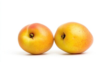 Close Up of Two Yellow Orange Apricots on a White Background in a Studio Shot