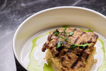 Deliciously Grilled Chicken Infused with Fresh Herbs Presented on a Minimalist Plate Design