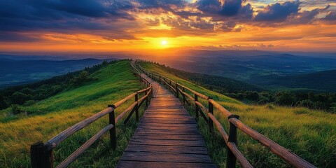 A scenic wooden boardwalk stretches gracefully down a lush, grassy hill, offering a serene pathway crafted with intricately placed wooden planks