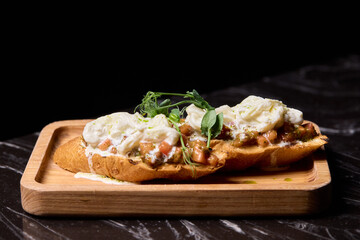 A Mouthwateringly Delicious Gourmet Dish Impeccably Served on a Rustic Wooden Plate