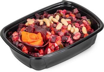 A black plastic container with salad, carrots, and pine nuts