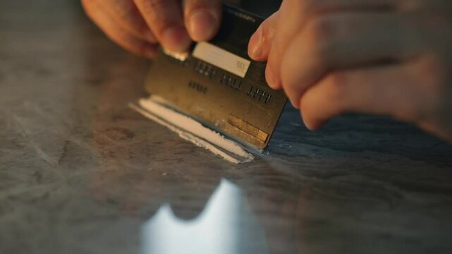 Drug use.
A man distributes drugs using a bank card.
The person is going to use drugs.
A person addicted to drugs.
Drug trafficking
