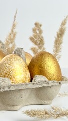 Stylish minimalist golden eggs easter concept. Easter gold eggs with dried reeds white background. Modern Easter celebration.