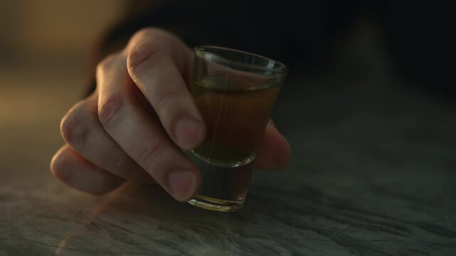 Alcoholism in humans.
A man is going through hard times and drinks alcohol.
A man drinks whiskey with ice.
Drunk man drinks alcohol.
Vodka, whiskey, alcohol, alcoholism, drunk, whiskey, rum