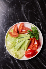 Delicious and Fresh Vegetable Salad featuring Crisp Lettuce, Juicy Tomatoes, and Cool Cucumbers