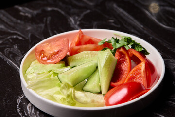 Delicious and Fresh Vegetable Salad featuring Crisp Lettuce, Juicy Tomatoes, and Cool Cucumbers