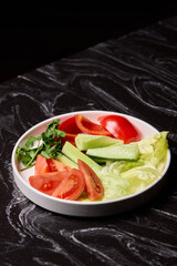 Delicious and Fresh Vegetable Salad featuring Crisp Lettuce, Juicy Tomatoes, and Cool Cucumbers