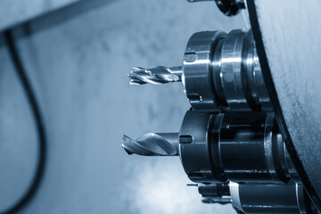 The hole tool in the tool magazine of machining center in the light blue scene.