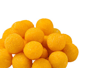 Bright yellow cheese balls stacked on a white background