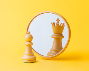 Chess pawn reflects as king in mirror isolated on yellow background. Symbol of ambition, delusion, leadership, success, strategy, self-perception, ego, confidence, narcissism. Minimal concept.