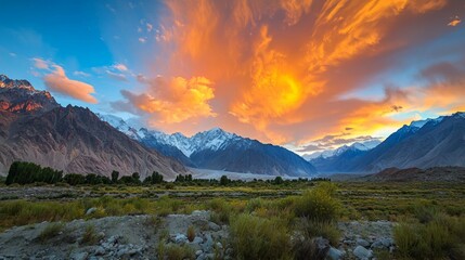 Majestic Sunrise Over Snow-Capped Mountains and Lush Green Valley