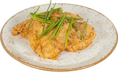 A white plate that is beautifully topped with fried food and fresh green beans