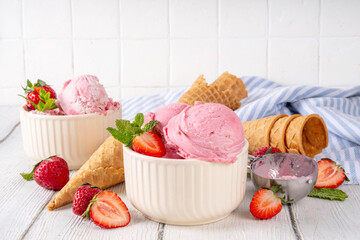 Summer refreshing cold dessert, tasty and aromatic strawberry ice cream, homemade berry sorbet in...