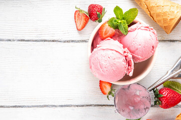 Summer refreshing cold dessert, tasty and aromatic strawberry ice cream, homemade berry sorbet in...