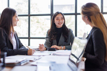 Business adviser meeting to analyze and discuss the situation on the financial report in the Asian meeting room.Investment Consultant, Financial advisor and accounting concept
