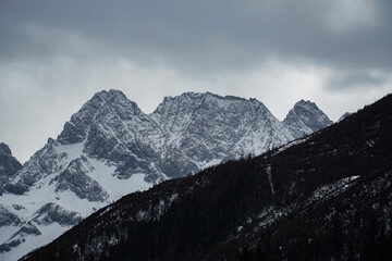 Obraz premium Majestic snow-capped mountains alpine region nature photography dramatic weather wide angle natural beauty