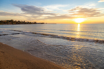 Panorama of sunset on the Mediterranean coast on a cloudy day. Mediterranean, Side, Antalya province, Turkey