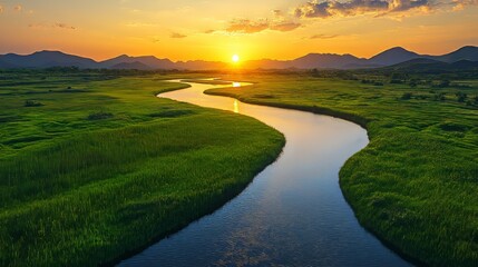 Fototapeta premium A description and keywords for your image are a serene sunset over a meandering river in a lush green valley