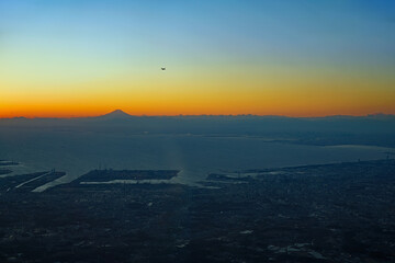 Sunset sky above the clouds with a view of Mount Fuji near Tokyo, Japan