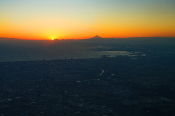 Sunset sky above the clouds with a view of Mount Fuji near Tokyo, Japan