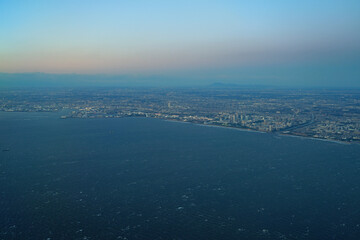 Aerial view of the Tokyo Bay, Japan, at nightfall in approach at Haneda Airport