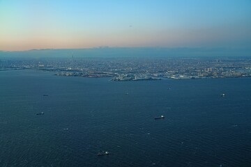 Aerial view of the Tokyo Bay, Japan, at nightfall in approach at Haneda Airport