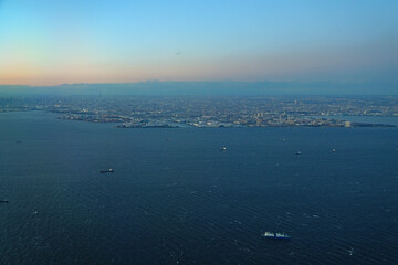 Aerial view of the Tokyo Bay, Japan, at nightfall in approach at Haneda Airport