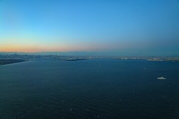 Aerial view of the Tokyo Bay, Japan, at nightfall in approach at Haneda Airport