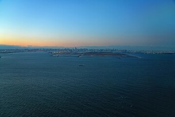 Aerial view of the Tokyo Bay, Japan, at nightfall in approach at Haneda Airport