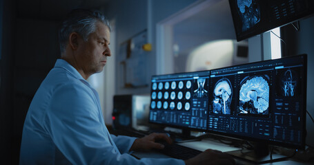 In Medical Laboratory Patient Undergoes MRI or CT Scan Process, in Control Room Doctor Watches...
