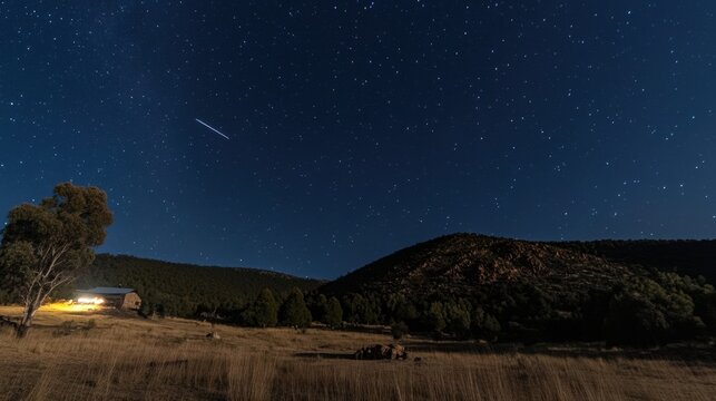 Night Sky Over Rural Cabin with Shooting Star