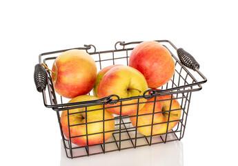 Several apples in a basket, close-up, isolated on a white background.