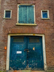 old green window with red shutters