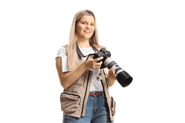 Full length shot of a young female journalist, photo reporter with a camera